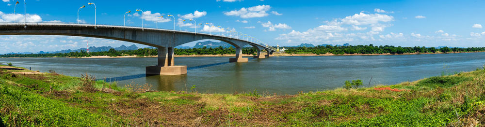 Bridge over river against sky