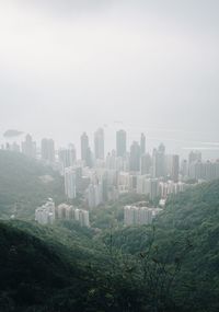 High angle view of buildings in city against sky