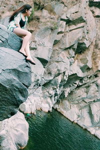 Woman standing on rock formation