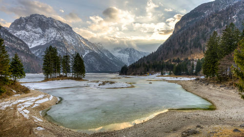 Scenic view of mountains against cloudy sky