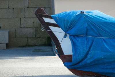 Close-up of wrapped boat on field