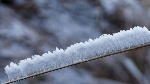 Close-up of snow covered metal during winter