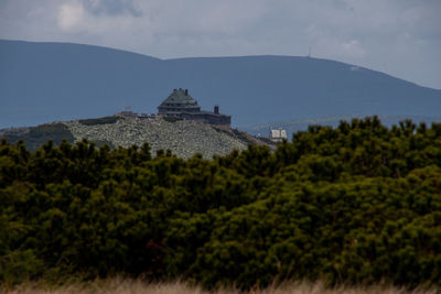 View of a mountain shelter on a hill against sky