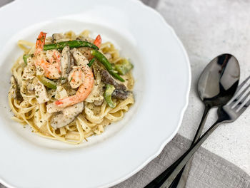 High angle view of pasta in plate on table