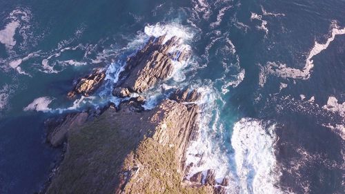 High angle view of rock formation in sea