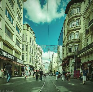 People walking on road in city