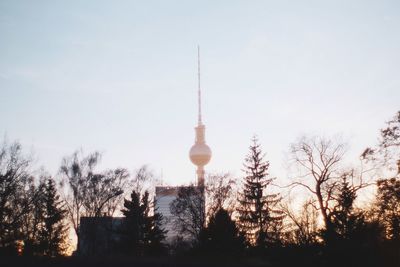 Low angle view of communications tower against sky