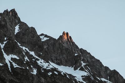 Scenic view of snowcapped mountains against clear sky