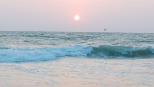 Scenic view of sea against clear sky during sunset