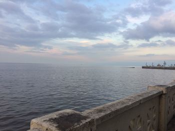 Scenic view of sea against cloudy sky