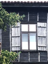 Low angle view of closed window of building