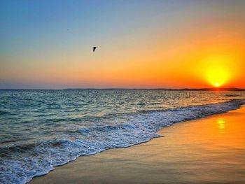 Scenic view of sea against sky during sunset