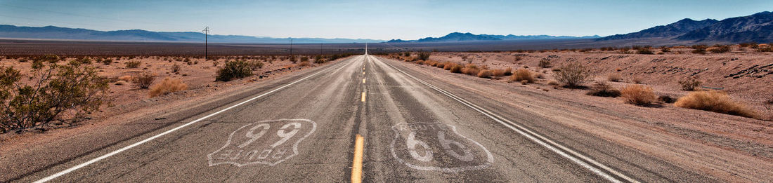 Road amidst landscape against sky