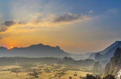 Scenic view of mountains against sky during sunset