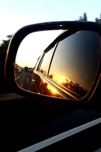 Reflection of sky on side-view mirror