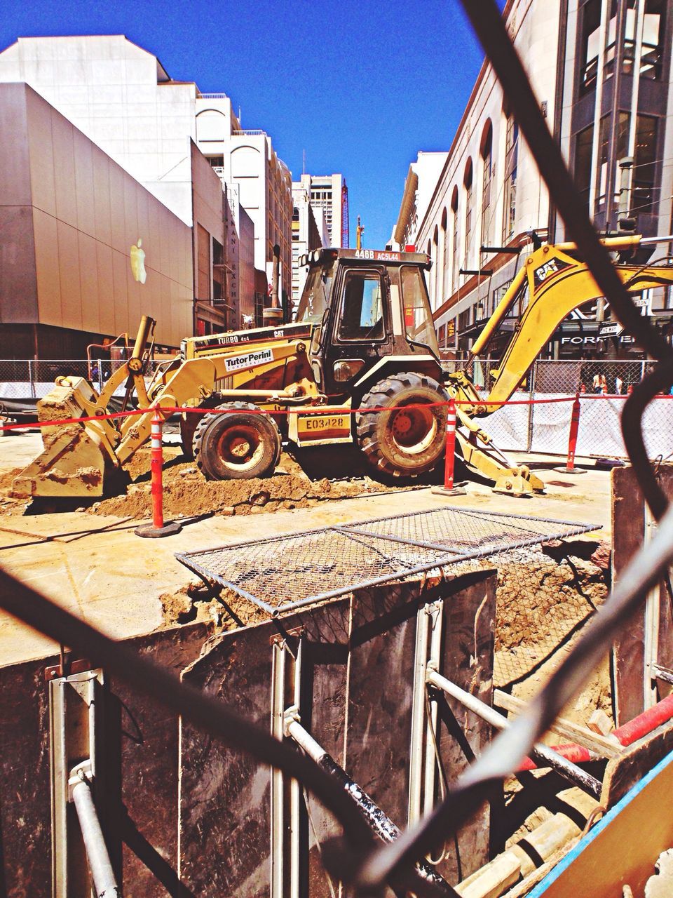 building exterior, built structure, architecture, residential building, residential structure, city, building, clear sky, railing, sunlight, house, construction site, outdoors, day, low angle view, transportation, no people, metal, roof, stack