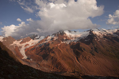 Glaciers at the foots of the palla bianca peak covered by clouds