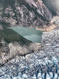 Scenic view of river by mountains