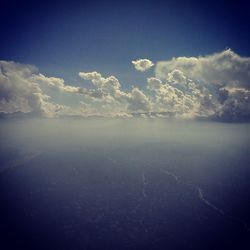 Scenic view of landscape against blue sky