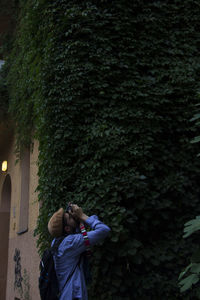 Close-up of man photographing in city