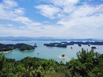 Scenic view of lake against cloudy sky