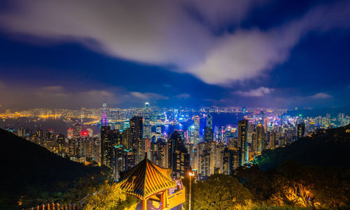 Panoramic view of illuminated buildings against sky at night