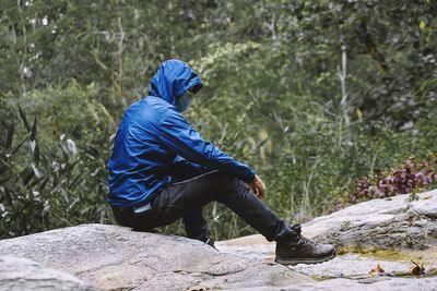 Portrait of man sitting alone