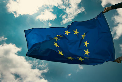 Low angle view of flag against sky