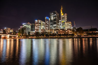 Illuminated city at waterfront