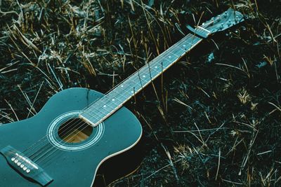 High angle view of guitar on field