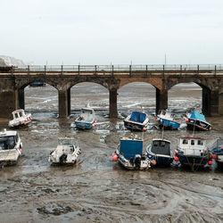 Cars on bridge against sky