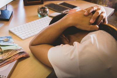 Woman leaning on desk