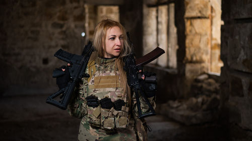 Portrait of young woman standing outdoors