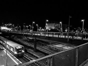 High angle view of railroad tracks at night