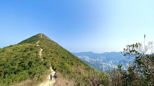 Scenic view of mountains against clear blue sky