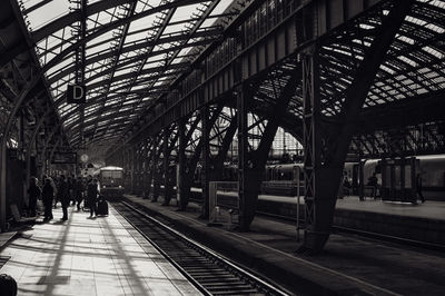 People waiting at railroad station platform