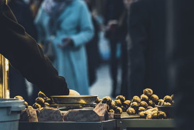 Man preparing food at market