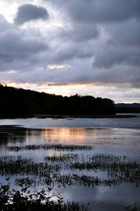 Scenic view of lake against sky during sunset