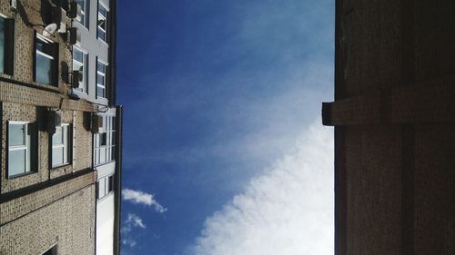 Low angle view of building against blue sky