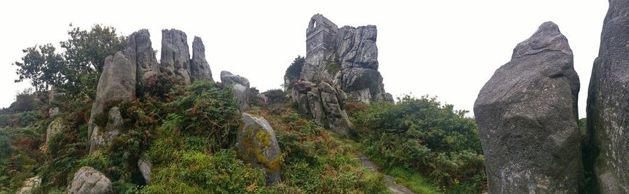 Low angle view of rock formation against sky