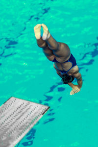 High angle view of swimmer diving into swimming pool