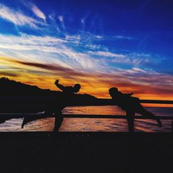 Silhouette of people at sunset