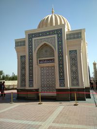 Exterior of temple building against clear sky