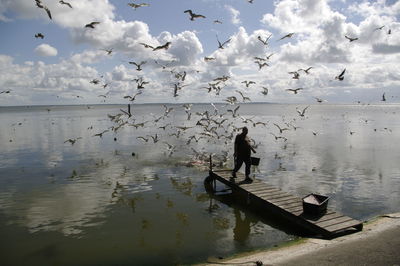 Full length of man on water against sky