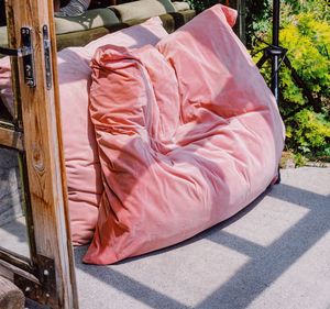 High angle view of pink drinking glass in yard