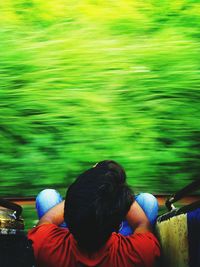 High angle view of man sitting at train doorway