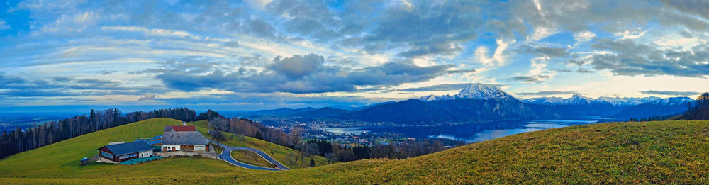 Panoramic view of buildings and mountains against sky