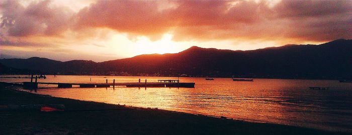 Scenic view of lake against dramatic sky