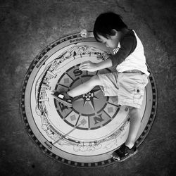 Full length of woman standing on wall