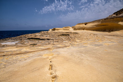 Scenic view of beach against sky